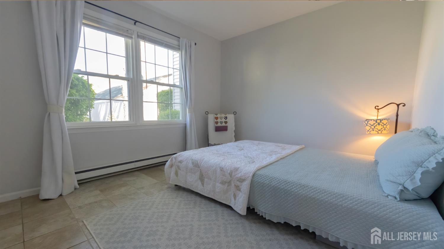 320 Sharon Way, Unit B Monroe Township, NJ 08831 - Photo 11 of 35 a bedroom with a bed and window