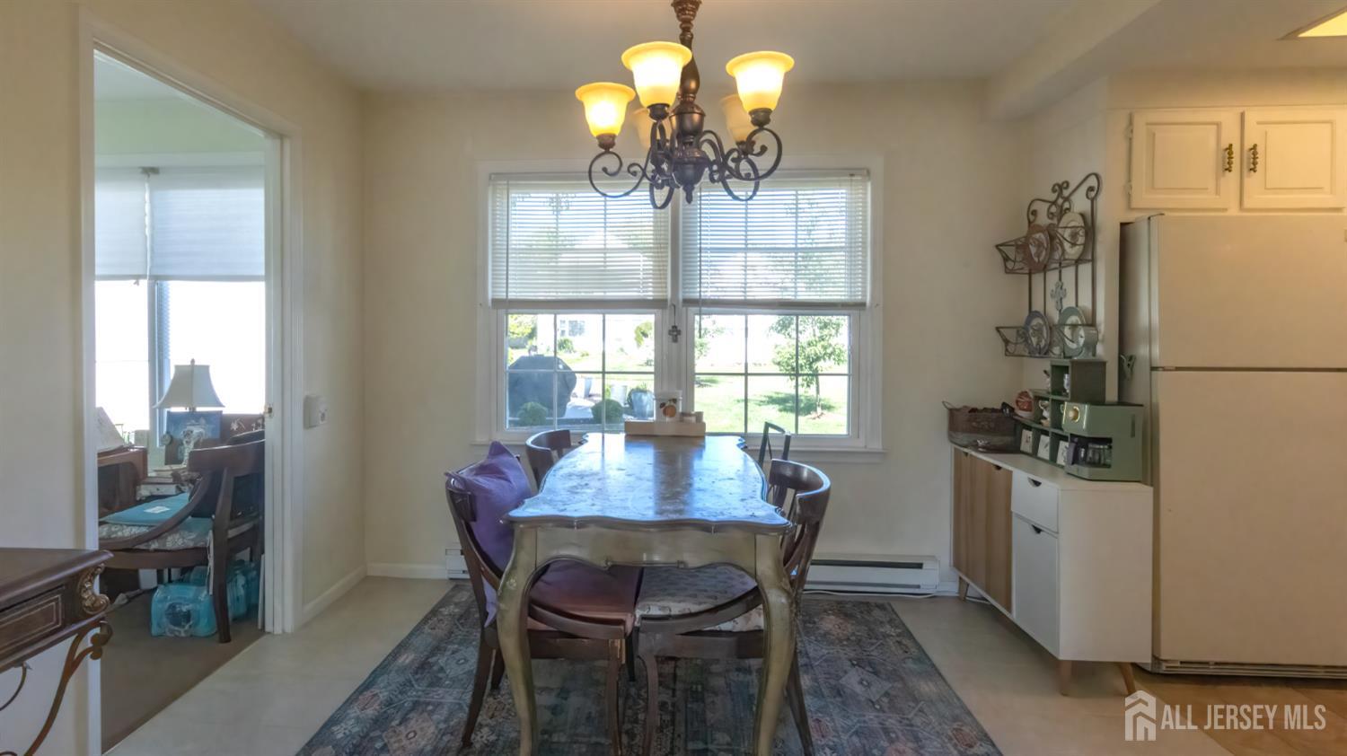 320 Sharon Way, Unit B Monroe Township, NJ 08831 - Photo 15 of 35 a dining room with furniture and window