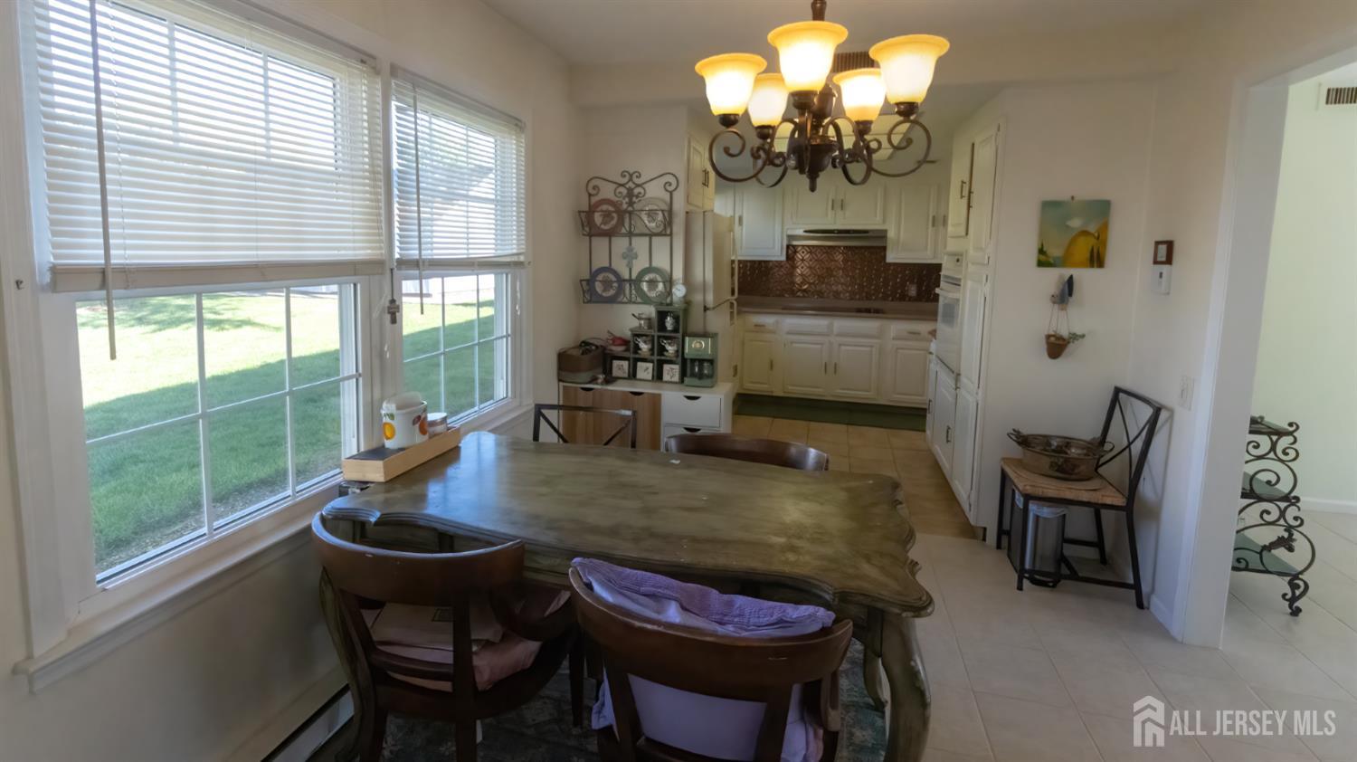 320 Sharon Way, Unit B Monroe Township, NJ 08831 - Photo 16 of 35 a dining room with furniture and window