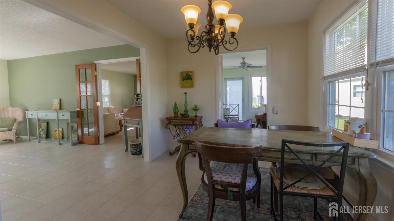 320 Sharon Way, Unit B Monroe Township, NJ 08831 - Photo 18 of 35 a view of a dining room with furniture and chandelier