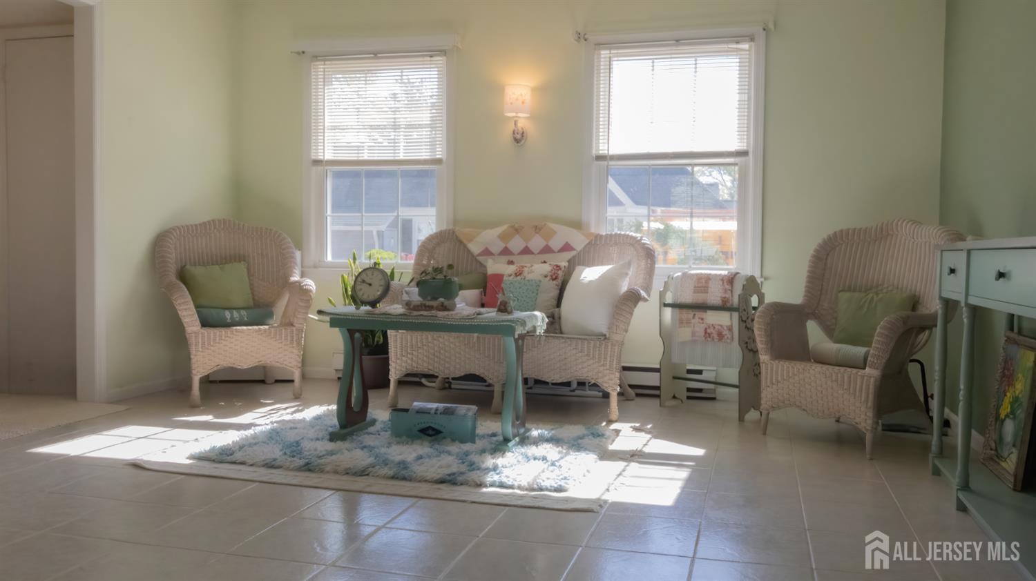 320 Sharon Way, Unit B Monroe Township, NJ 08831 - Photo 26 of 35 a dining room with furniture and a chandelier