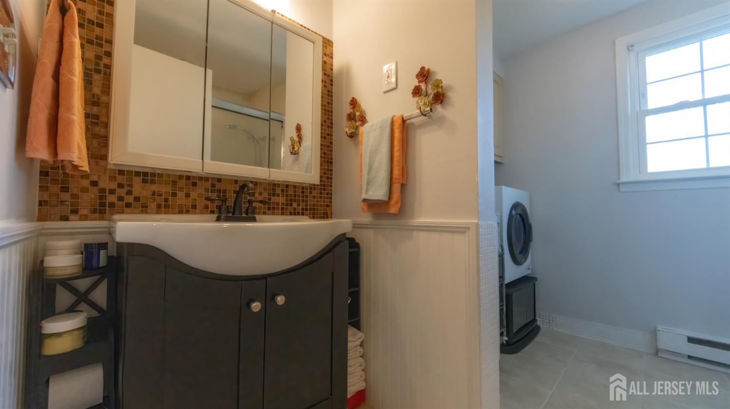320 Sharon Way, Unit B Monroe Township, NJ 08831 - Photo 31 of 35 a bathroom with a sink and a mirror