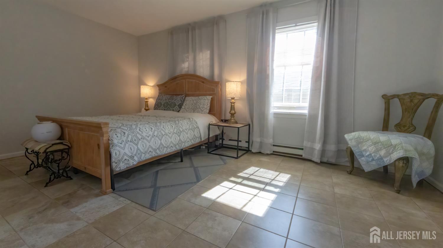 320 Sharon Way, Unit B Monroe Township, NJ 08831 - Photo 33 of 35 a bedroom with a bed and window