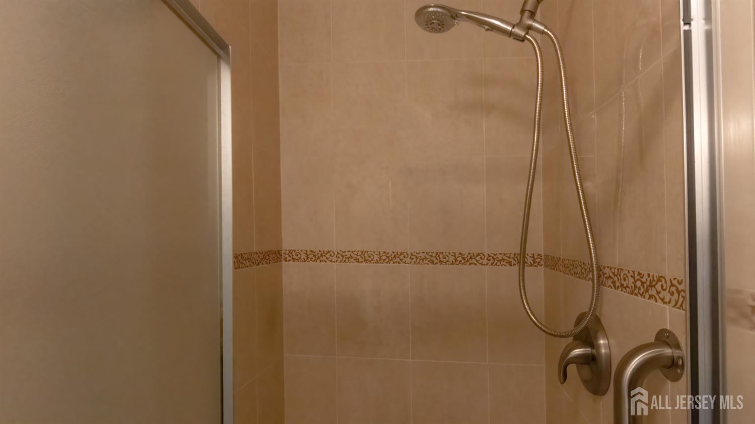 320 Sharon Way, Unit B Monroe Township, NJ 08831 - Photo 6 of 35 a bathroom with a glass shower door