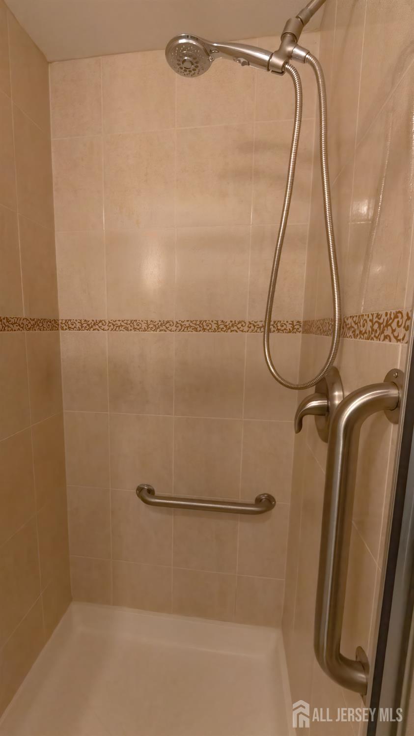 320 Sharon Way, Unit B Monroe Township, NJ 08831 - Photo 7 of 35 a bathroom with a shower and a bath tub