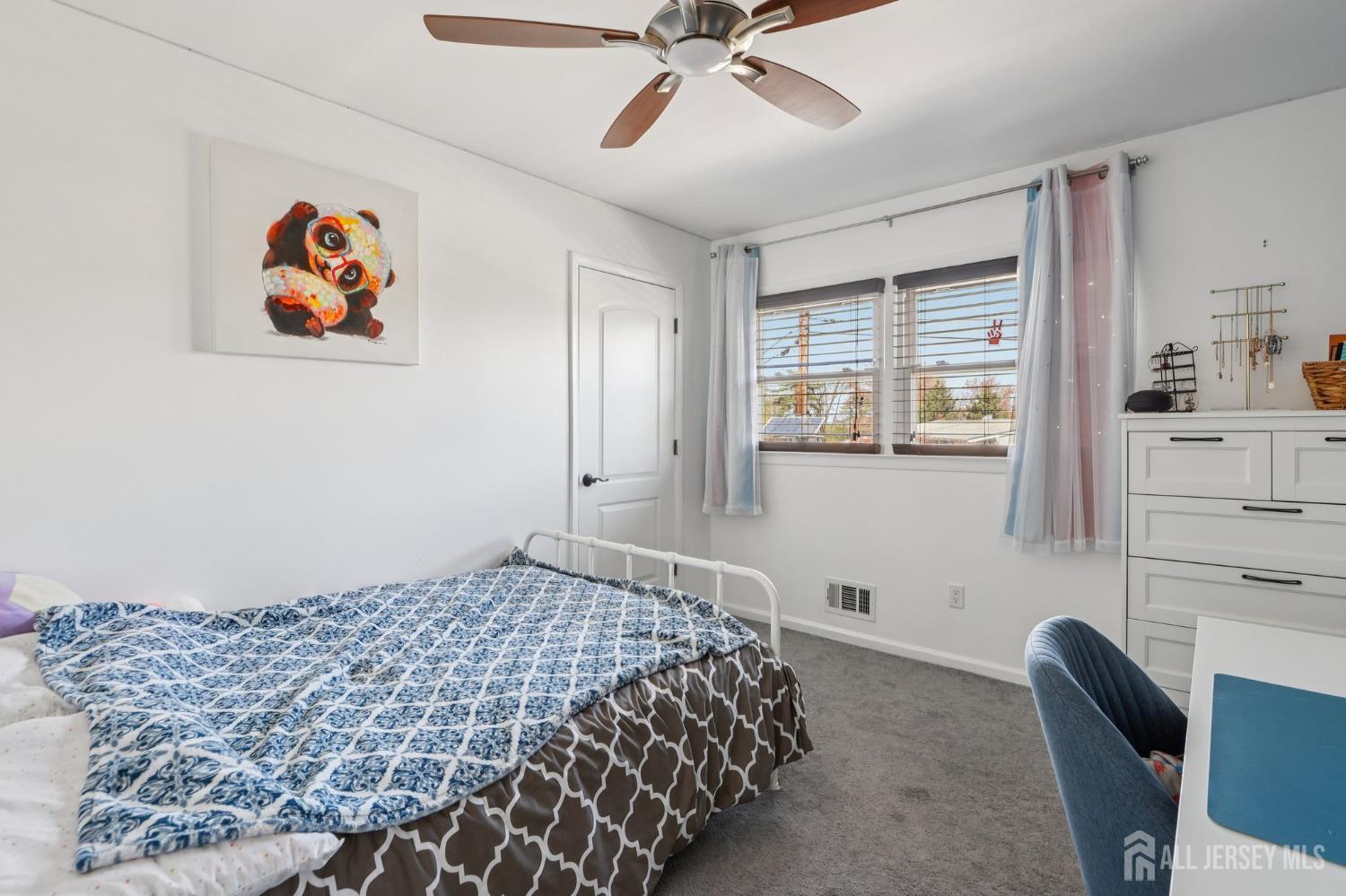 37 Merker Drive Edison, NJ 08837 - Photo 12 of 31 a bedroom with a bed and a painting on the wall