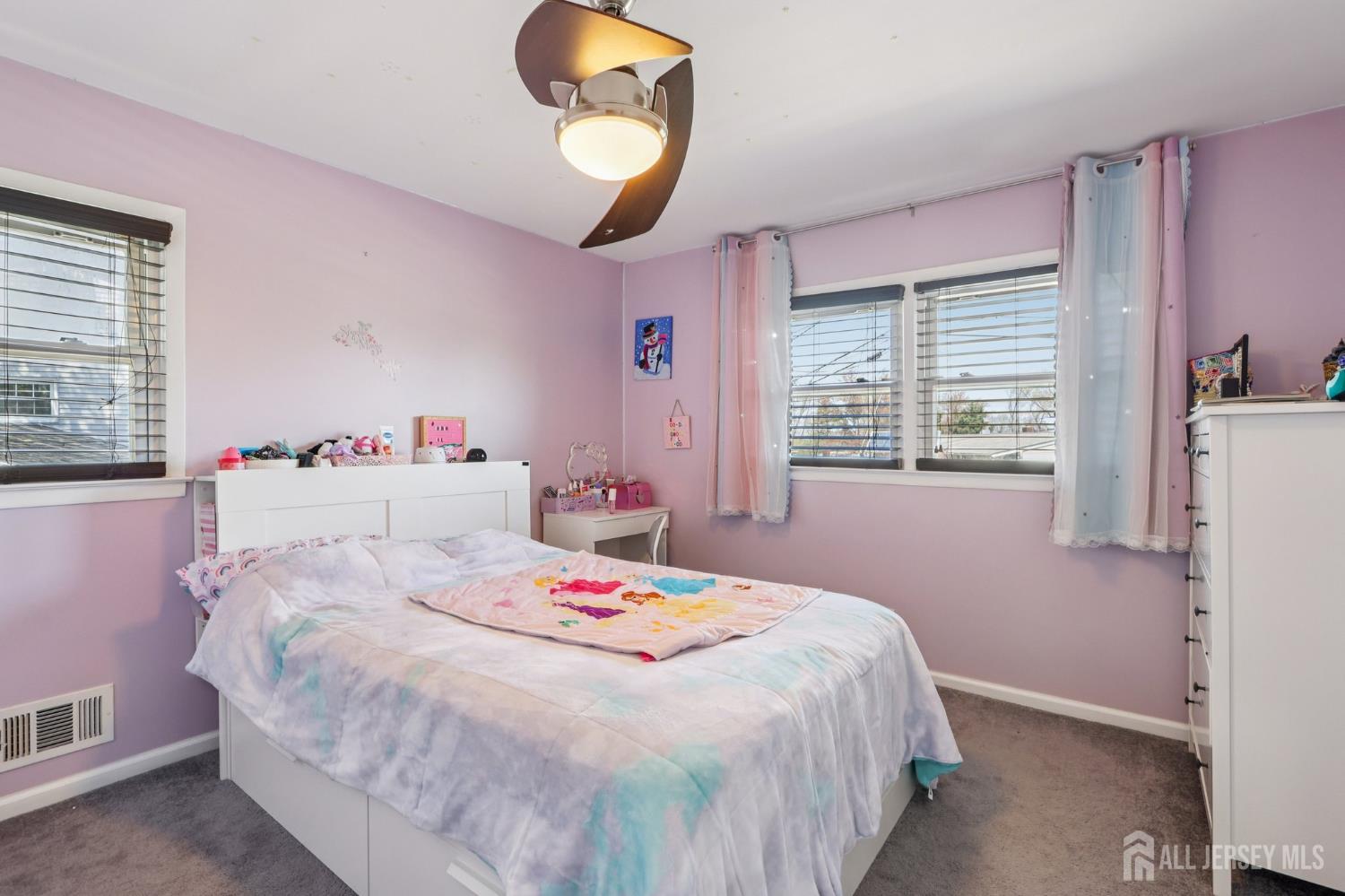 37 Merker Drive Edison, NJ 08837 - Photo 15 of 31 a bedroom with a bed and a chandelier