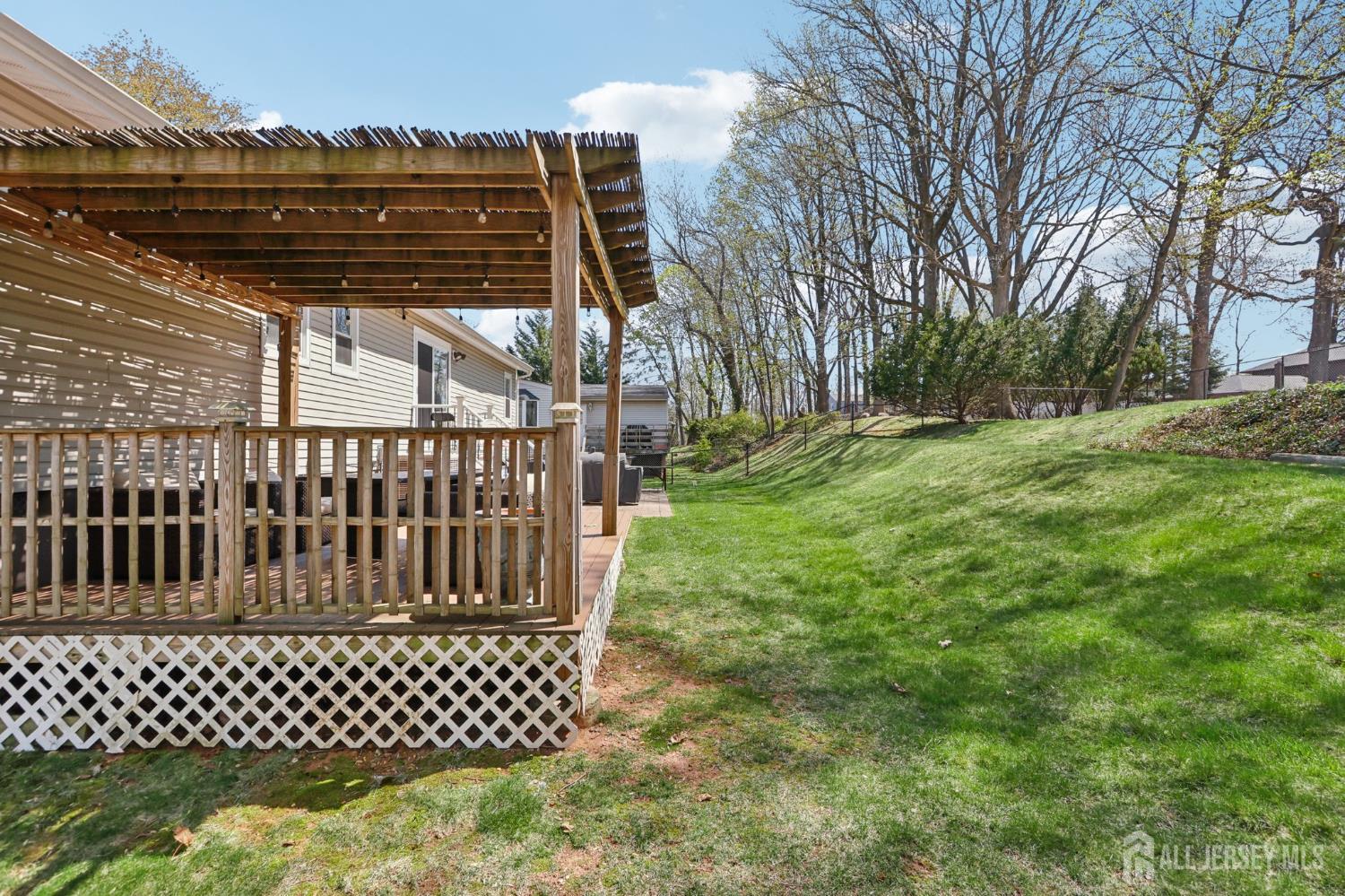 37 Merker Drive Edison, NJ 08837 - Photo 24 of 31 a view of a yard with wooden fence