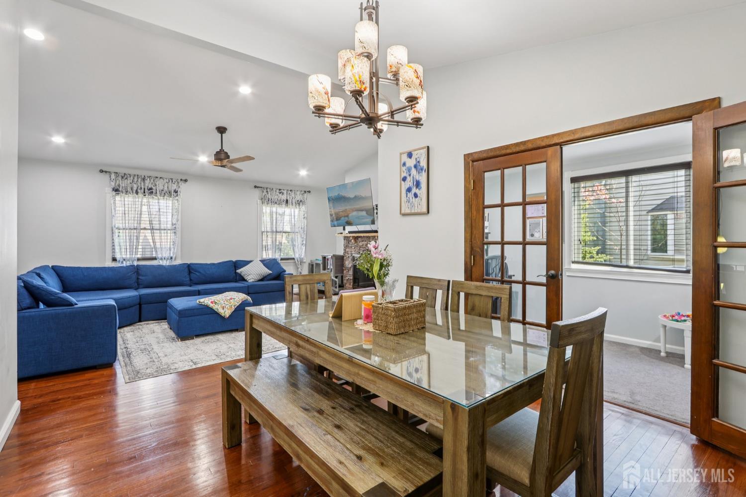 37 Merker Drive Edison, NJ 08837 - Photo 7 of 31 a view of a dining room with furniture a chandelier and wooden floor