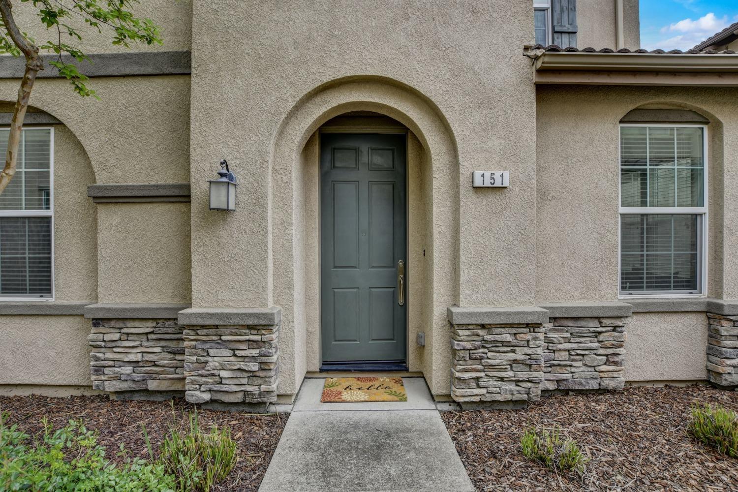 a front view of a house with stairs