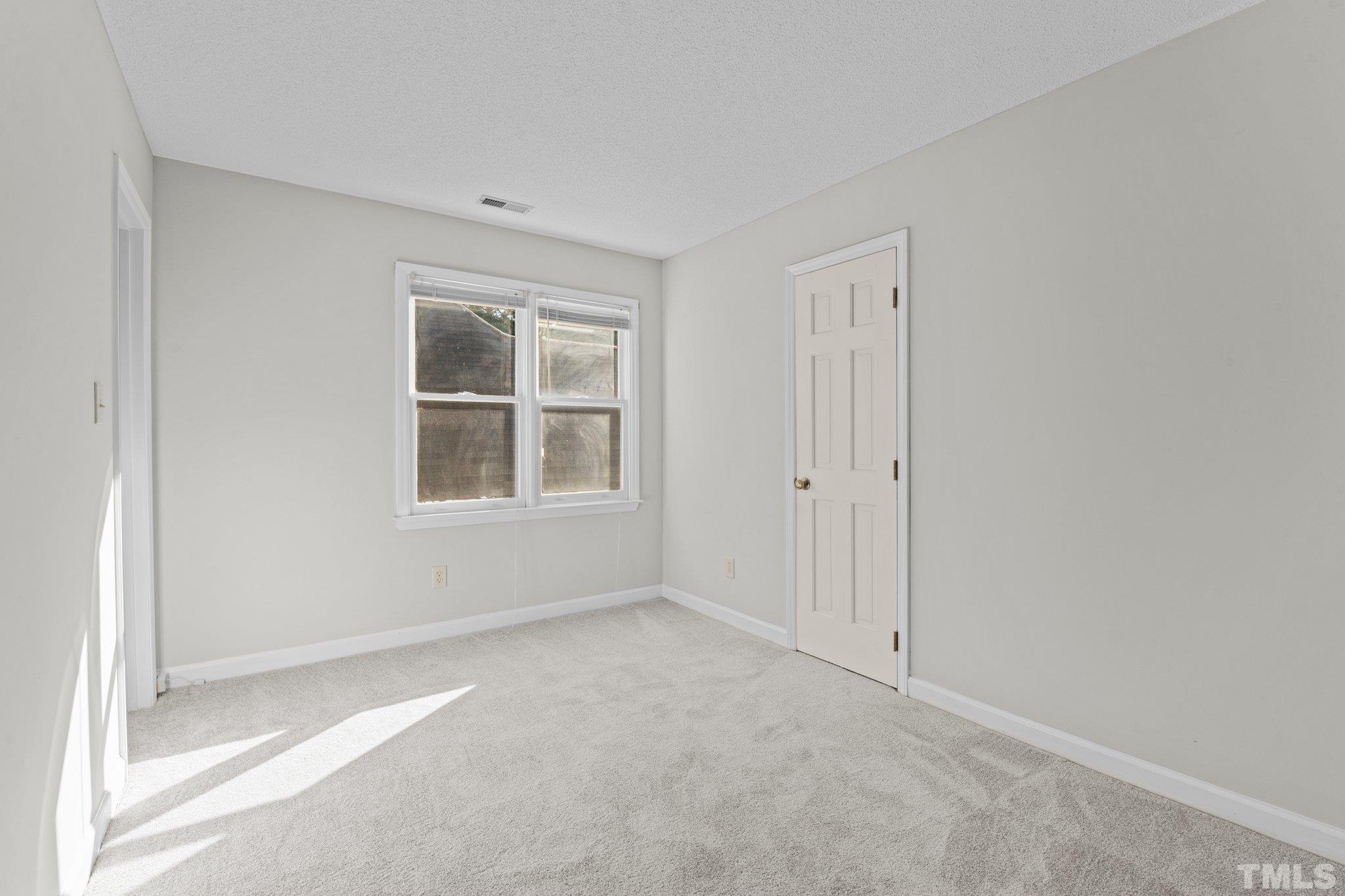 4405 Birmingham Way Raleigh, NC 27604 - Photo 15 of 22 a view of an empty room with a window