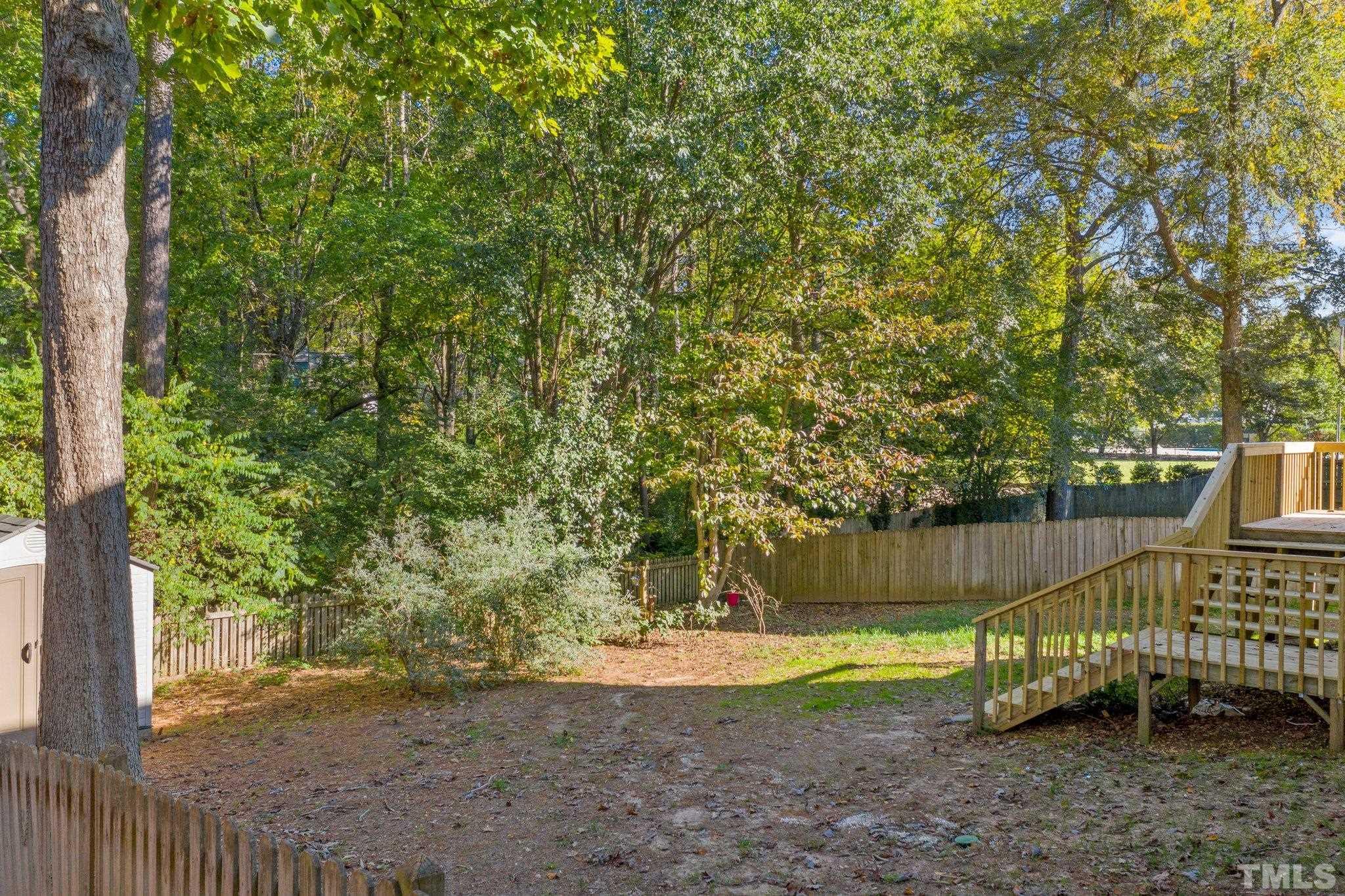 4405 Birmingham Way Raleigh, NC 27604 - Photo 18 of 22 a view of a backyard with swimming pool