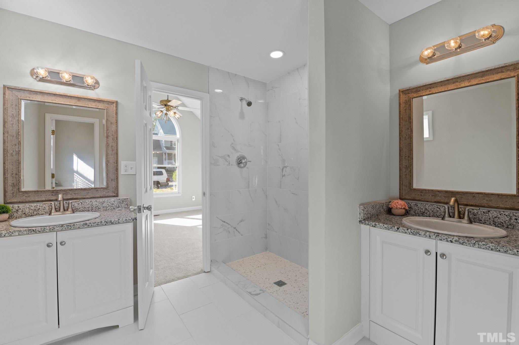 4405 Birmingham Way Raleigh, NC 27604 - Photo 5 of 22 a bathroom with a sink and a mirror