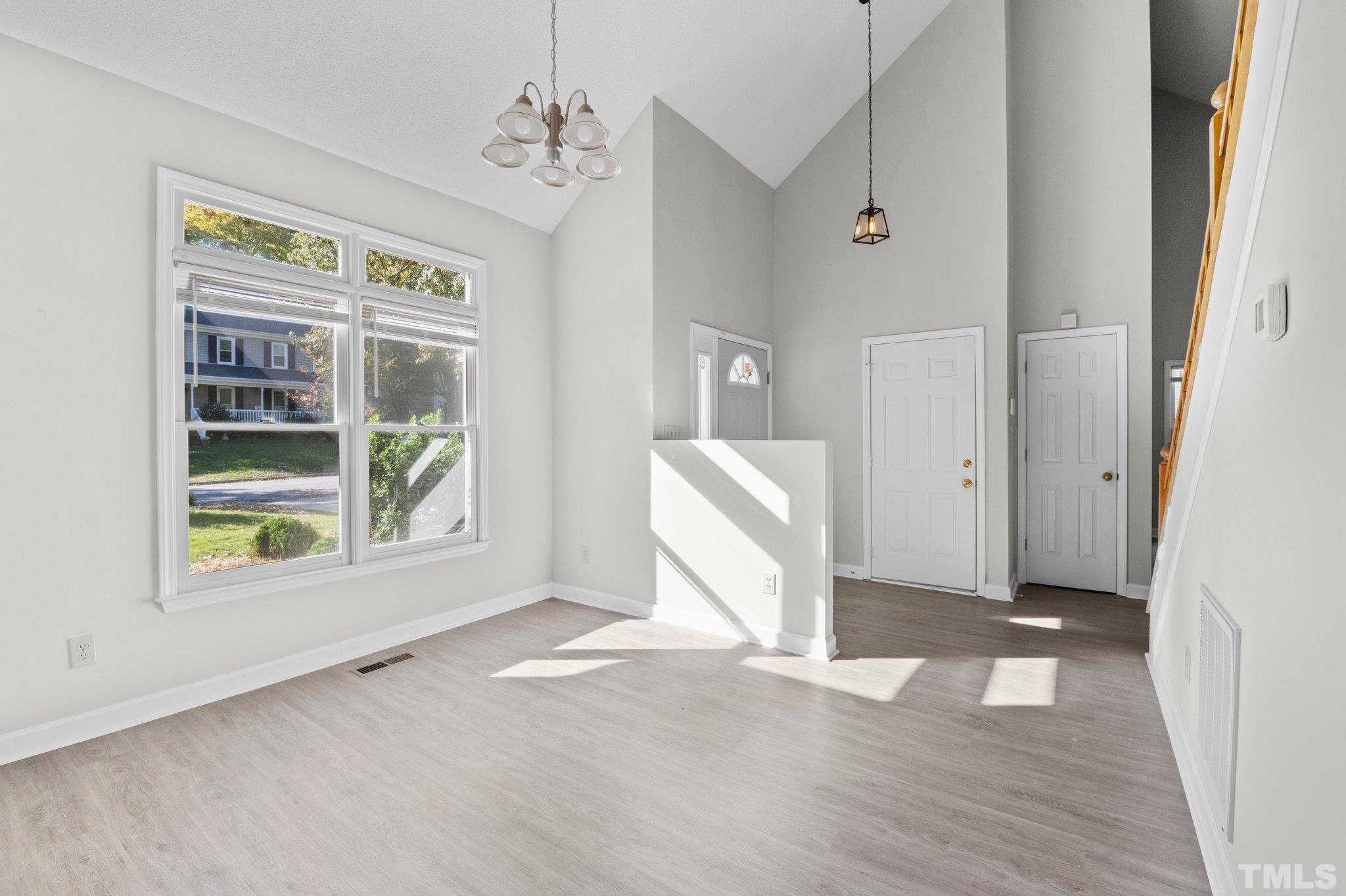 4405 Birmingham Way Raleigh, NC 27604 - Photo 10 of 22 a view of a room with a window and wooden floor