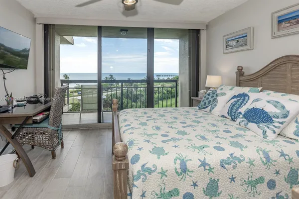a view of a livingroom with workspace and a window