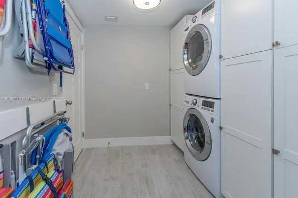 a bedroom with a bed and a lamp