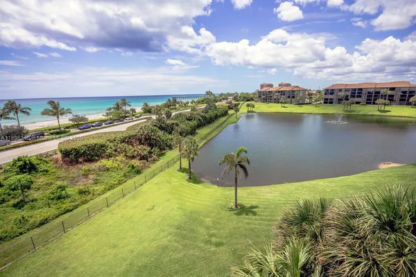 a view of a lake with a yard