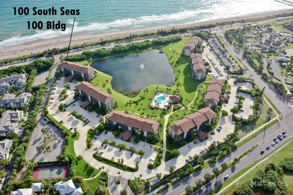 an aerial view of a residential houses with street