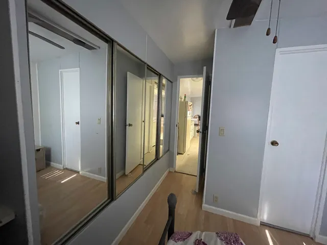 a view of a dining room with furniture and a chandelier