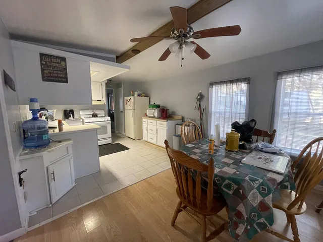 a view of a houses with trees