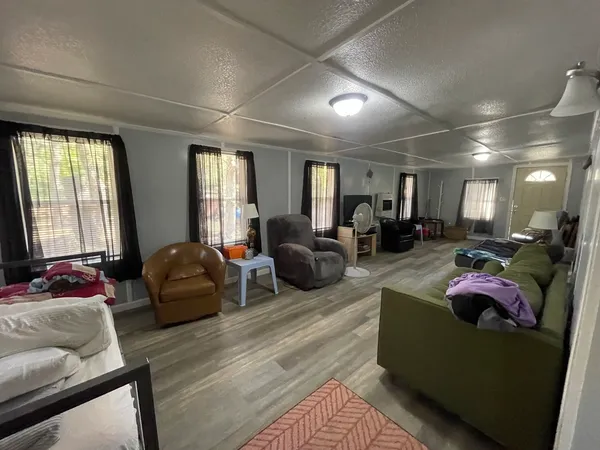 a living room with furniture window and a couch