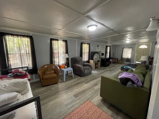 a living room with furniture window and a couch