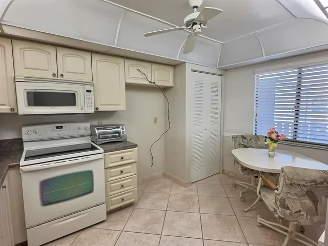 a kitchen with stainless steel appliances a stove a sink and cabinets