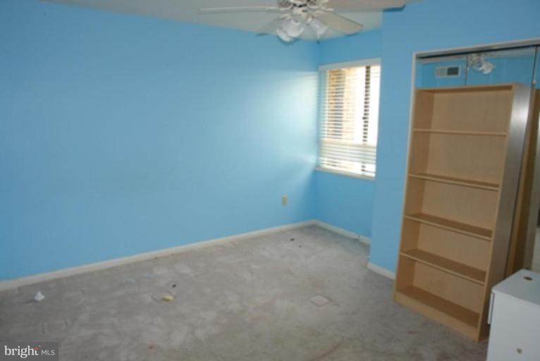 2109 Walsh View Terrace, Unit 301 Silver Spring, MD 20902 - Photo 4 of 4 an empty room with a fireplace