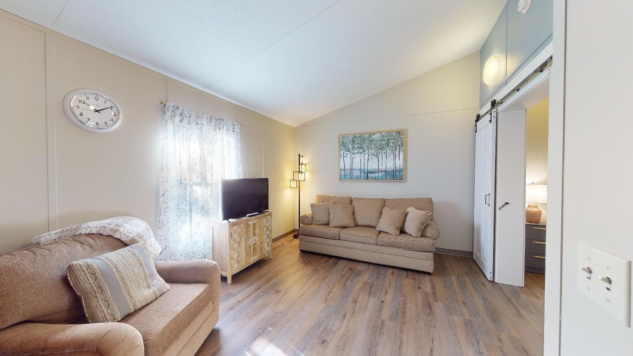 5585 Straub Road College Station, TX 77845 - Photo 12 of 50 a living room with furniture and a flat screen tv