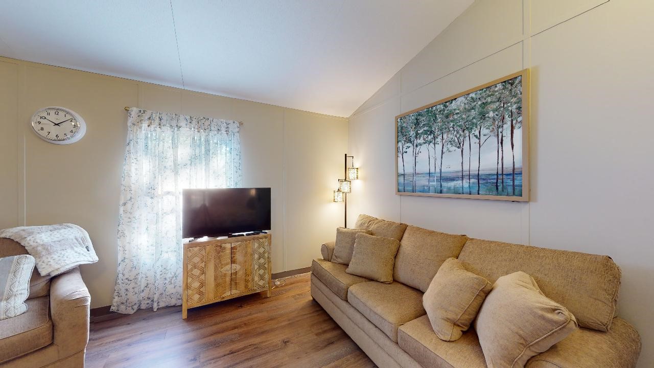 5585 Straub Road College Station, TX 77845 - Photo 16 of 50 a living room with furniture and a flat screen tv