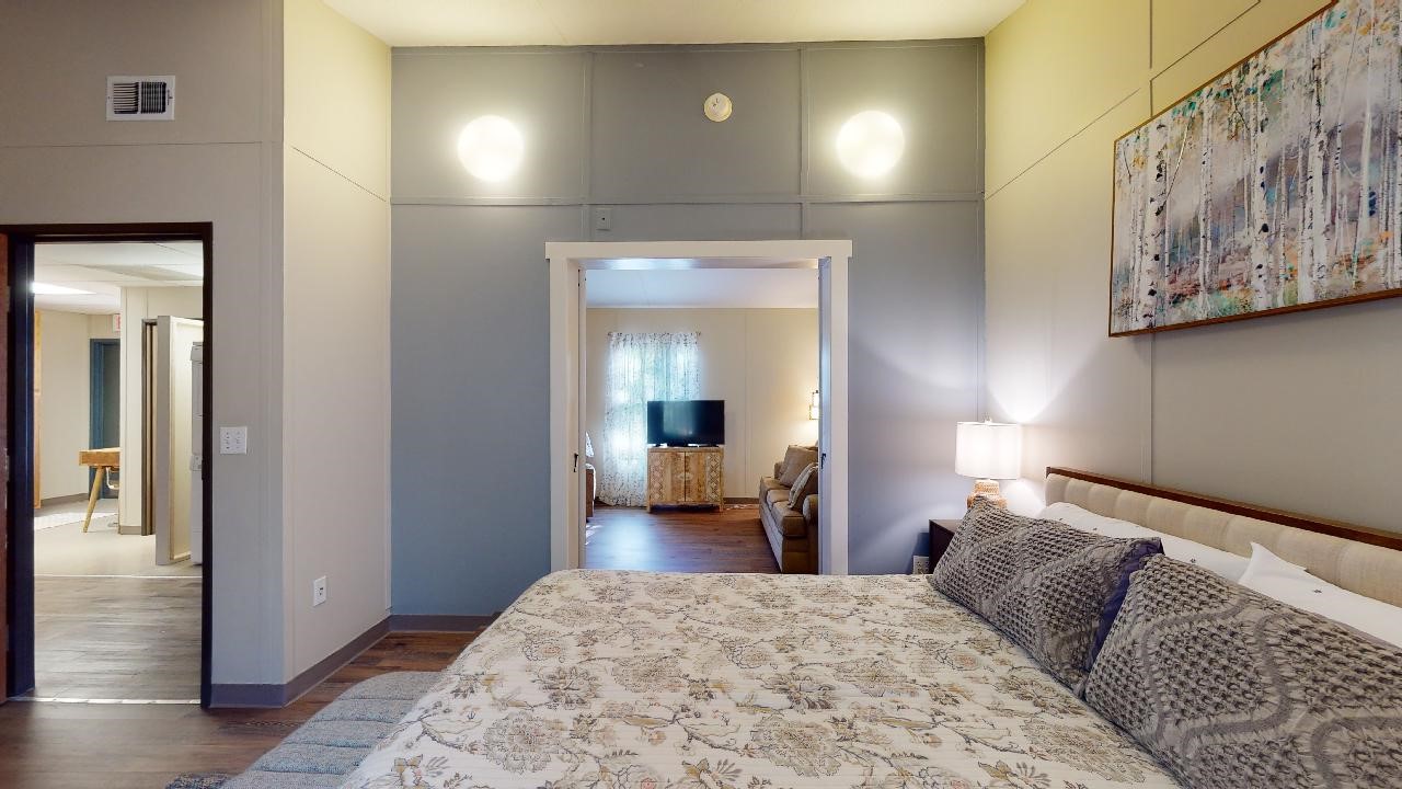 5585 Straub Road College Station, TX 77845 - Photo 19 of 50 a bedroom with a bed and lamp