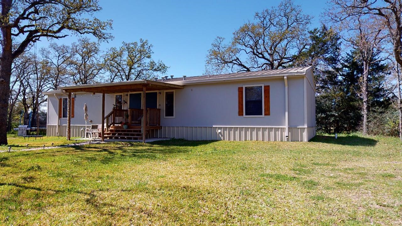 5585 Straub Road College Station, TX 77845 - Photo 2 of 50 a view of a house with backyard and sitting area