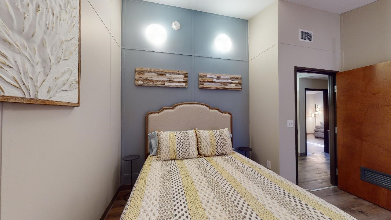 5585 Straub Road College Station, TX 77845 - Photo 23 of 50 a bedroom with a bed and a night stand