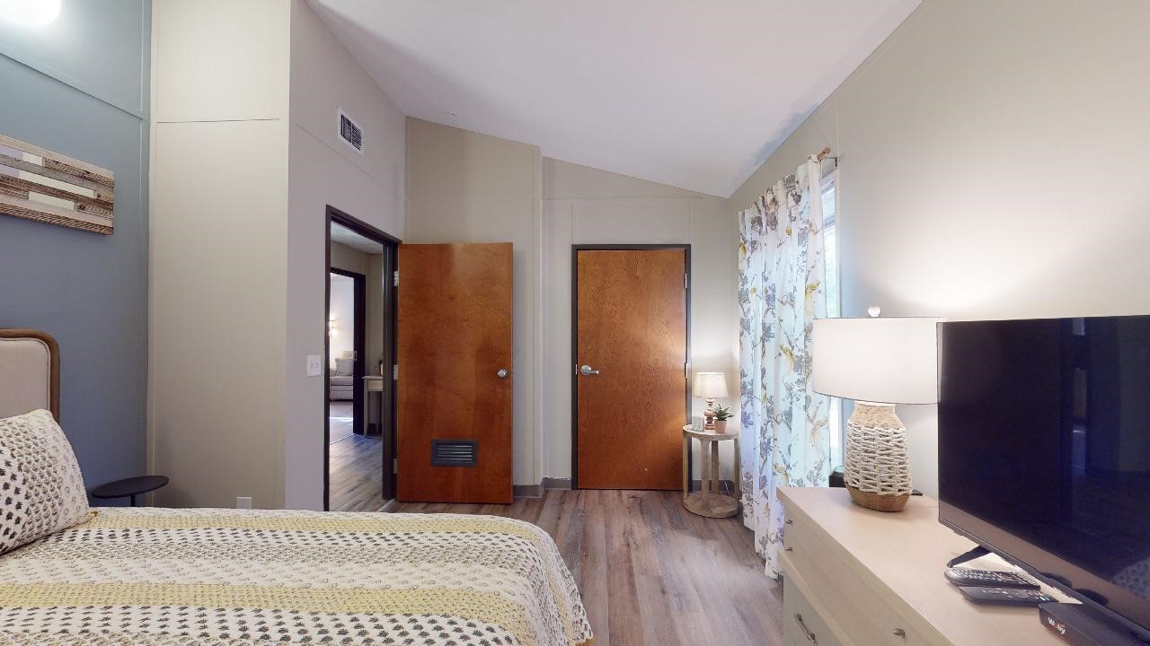 5585 Straub Road College Station, TX 77845 - Photo 24 of 50 a bedroom with a bed and wooden floor