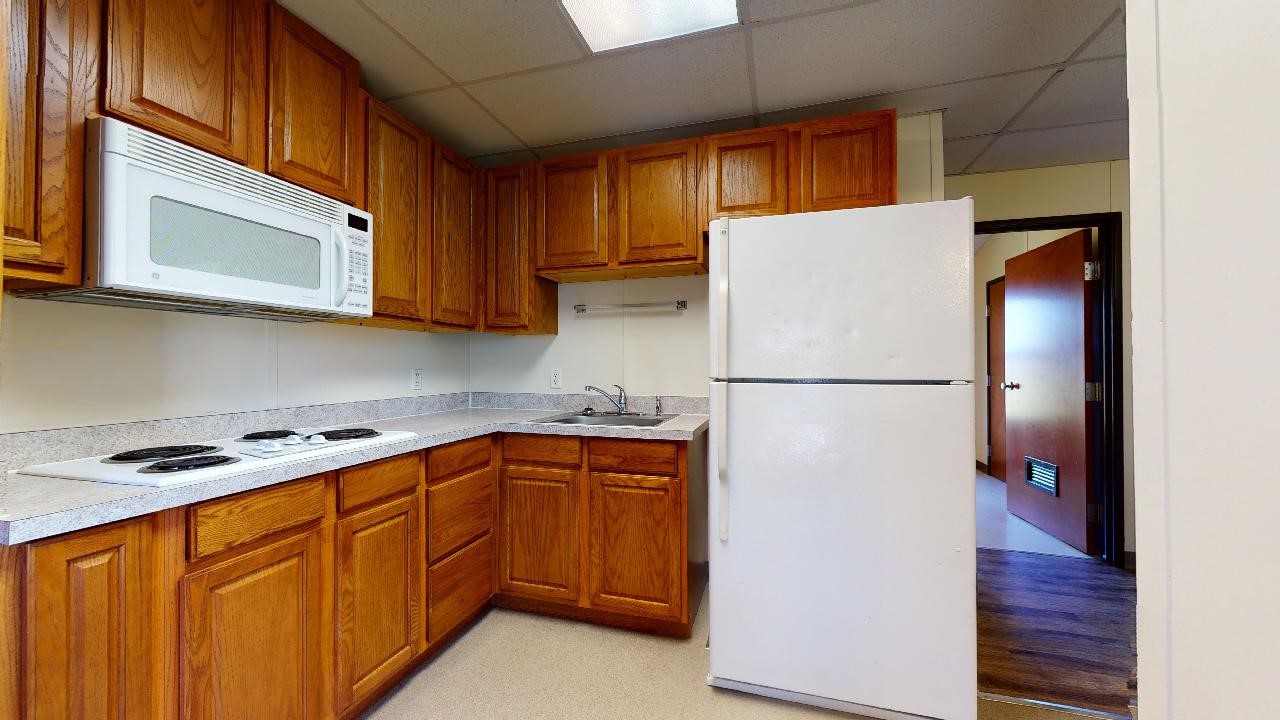 5585 Straub Road College Station, TX 77845 - Photo 29 of 50 a kitchen with stainless steel appliances granite countertop a refrigerator sink and microwave