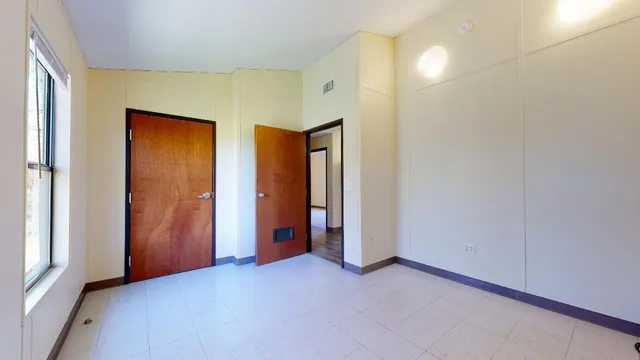 an empty room with windows