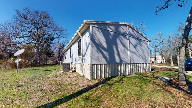 a house with a tree in the background
