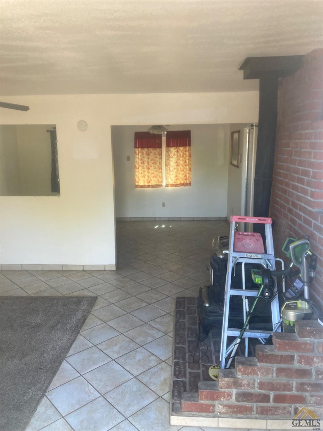 Undisclosed Address Buttonwillow, CA 93206 - Photo 12 of 56 a front view of a house with stairs