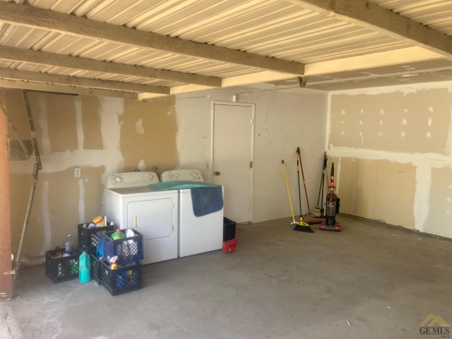 Undisclosed Address Buttonwillow, CA 93206 - Photo 14 of 56 a view of a room with shelves