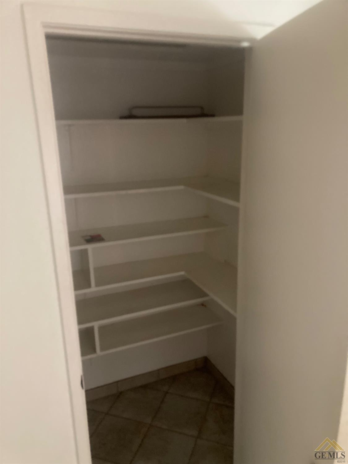 Undisclosed Address Buttonwillow, CA 93206 - Photo 16 of 56 a view of walk in closet with clothes