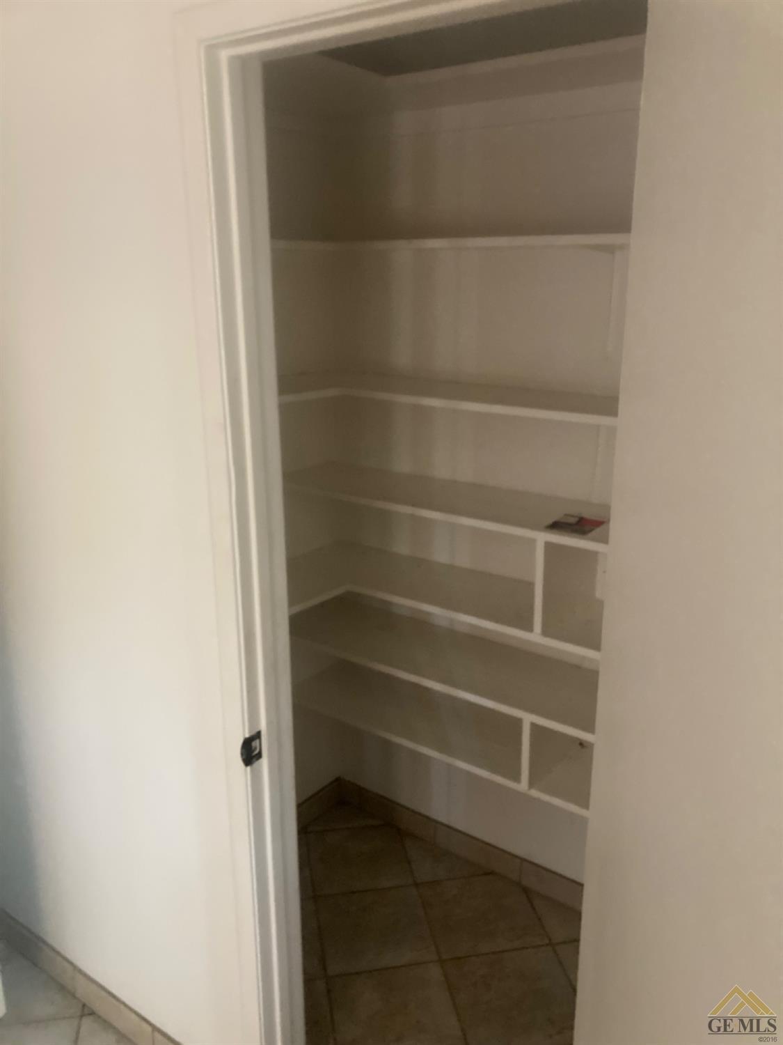 Undisclosed Address Buttonwillow, CA 93206 - Photo 17 of 56 a view of a room with empty racks