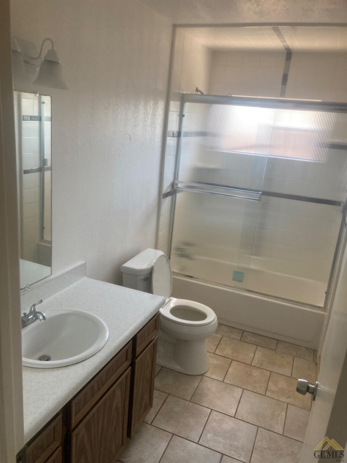 Undisclosed Address Buttonwillow, CA 93206 - Photo 21 of 56 a bathroom with a sink a toilet and shower