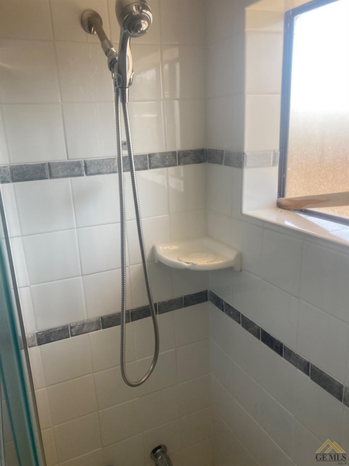 Undisclosed Address Buttonwillow, CA 93206 - Photo 22 of 56 a bathroom with a sink and a window