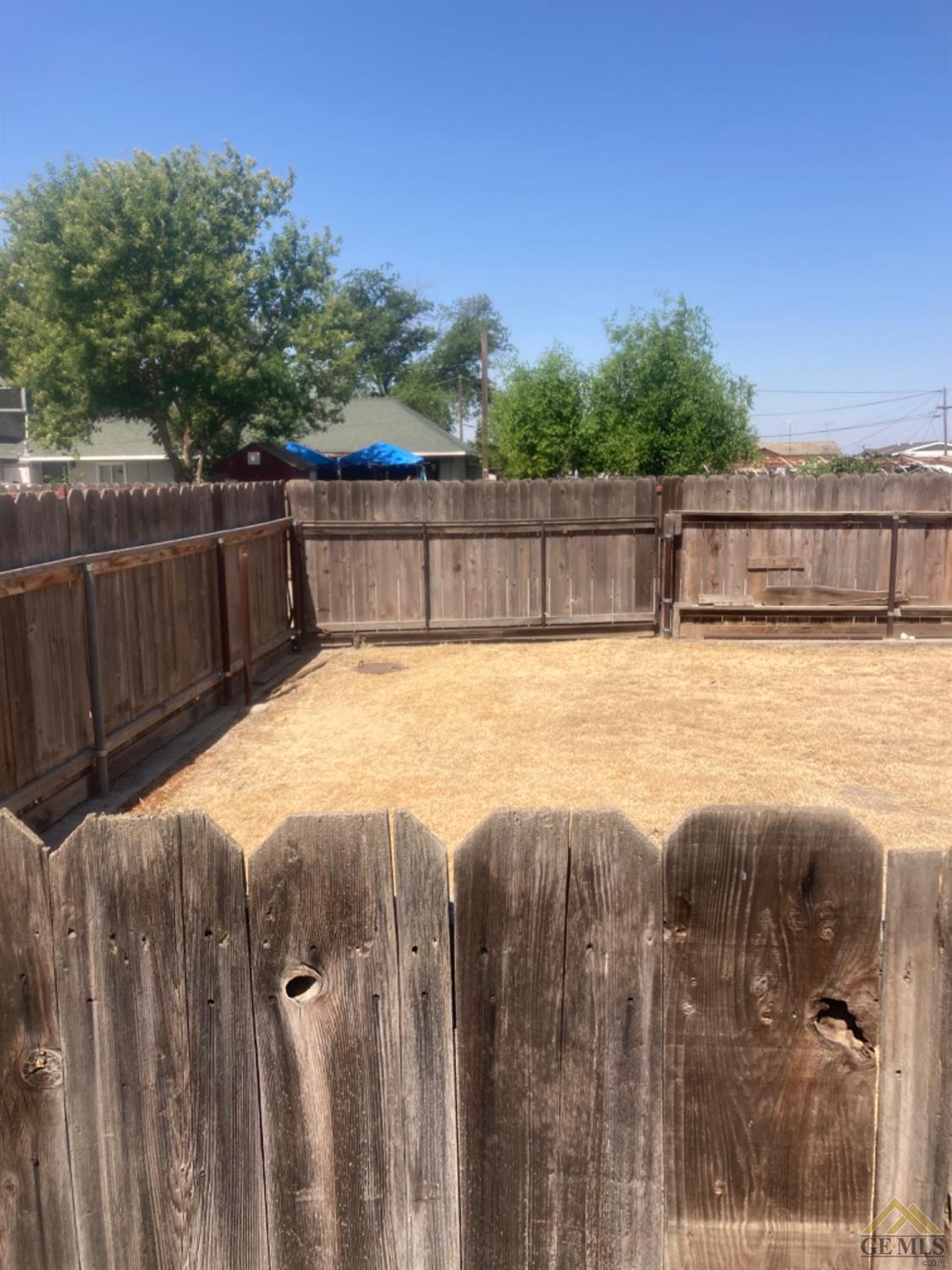 Undisclosed Address Buttonwillow, CA 93206 - Photo 42 of 56 a view of a balcony with floor to ceiling window and wooden fence