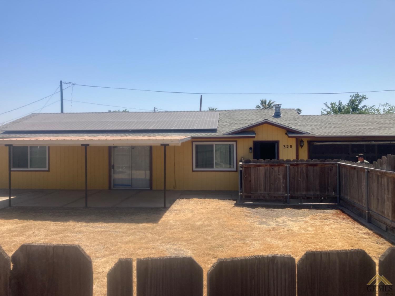 Undisclosed Address Buttonwillow, CA 93206 - Photo 46 of 56 a view of a house with a yard