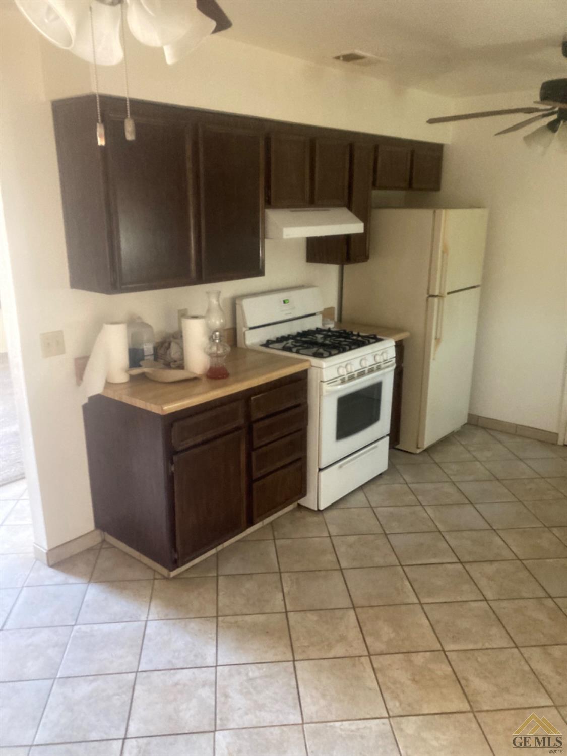 Undisclosed Address Buttonwillow, CA 93206 - Photo 7 of 56 a kitchen with stainless steel appliances a stove a sink a microwave and a refrigerator