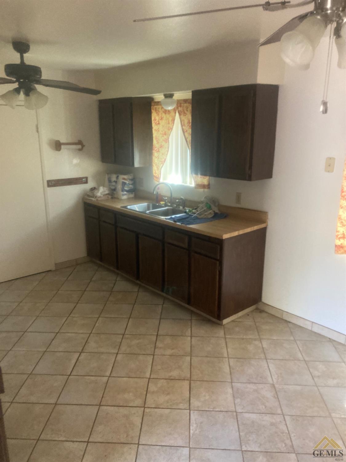 Undisclosed Address Buttonwillow, CA 93206 - Photo 8 of 56 a kitchen with stainless steel appliances a stove a sink and a microwave