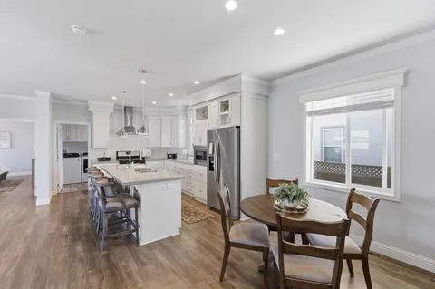 a kitchen with a table and chairs in it