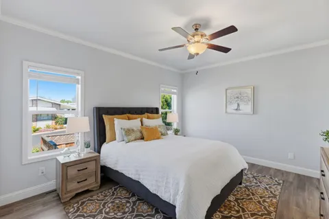 a bedroom with a large bed and a window
