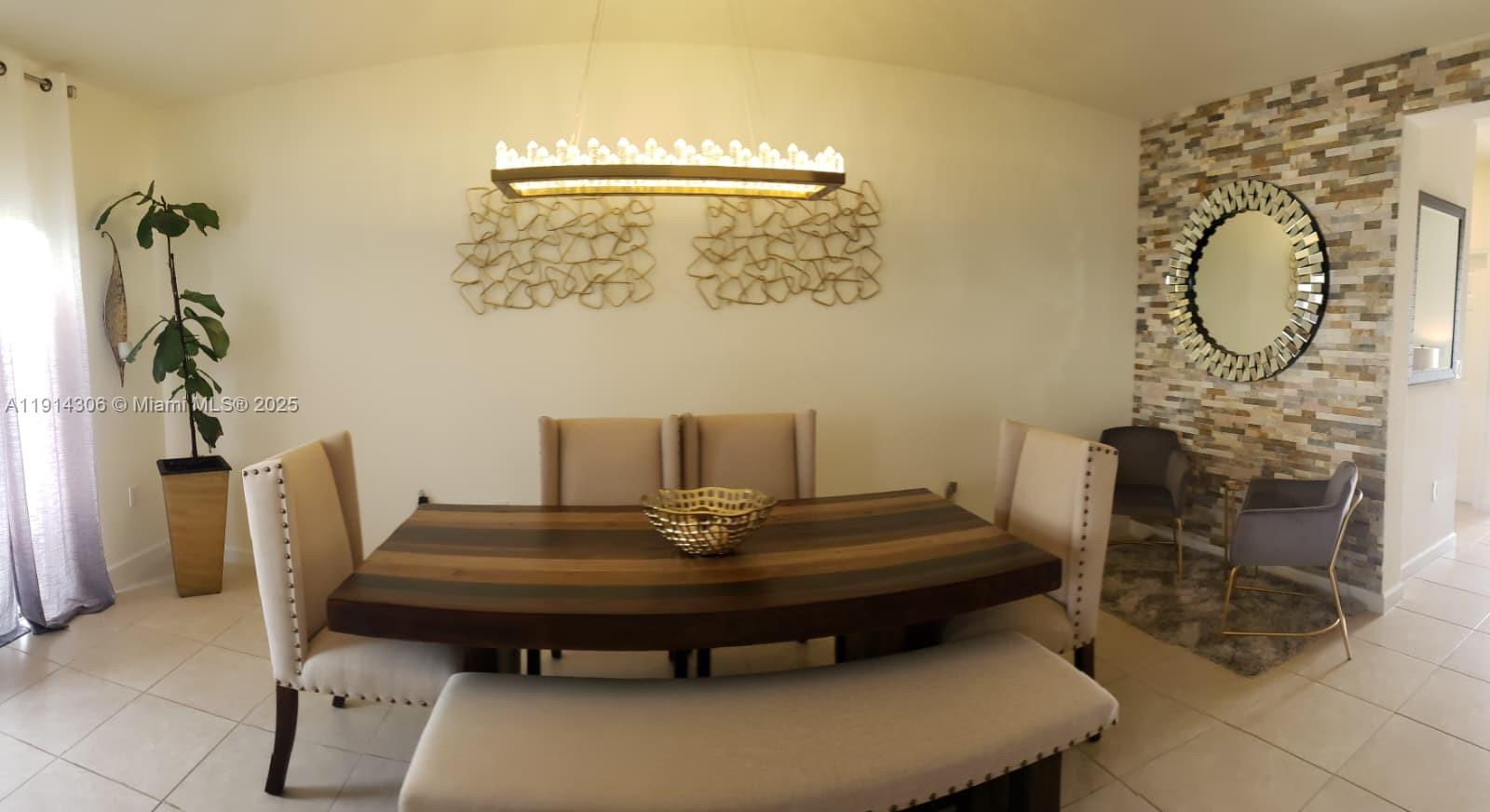 a room with a table and a fireplace